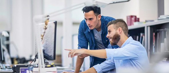 two designers working on computer